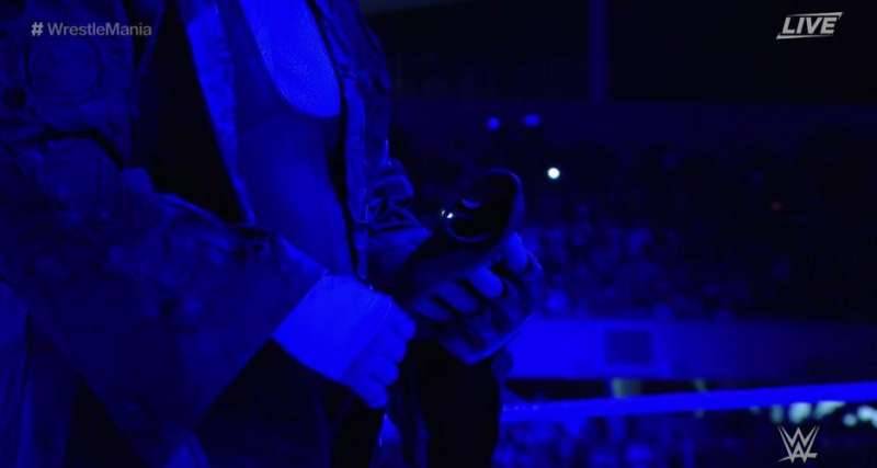 The Undertaker Took Off His Gloves And Placed Them In The Centre Of The Ring