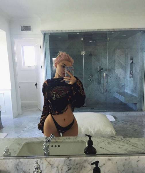 Kylie Jenner raises temperatures by flashing the flesh in revealing selfie as she poses in her pants