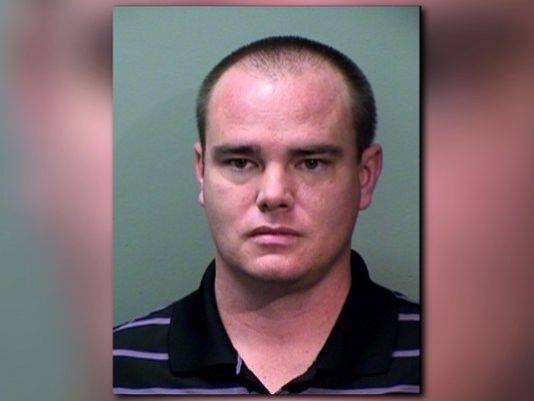 Teacher arrested after pair found dead on driveway