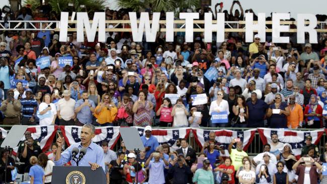 Obama seeks to settle scores with Republicans as he campaigns for Clinton