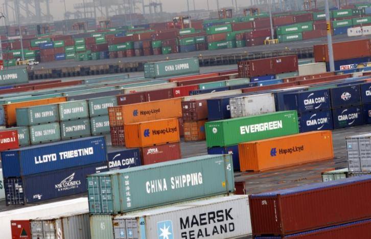 U.S. goods trade deficit widens; labor market near full strength
