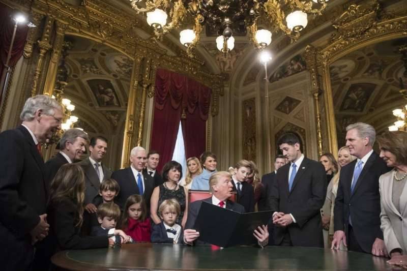 Donald Trump played the outsider and the insider on his first day in office