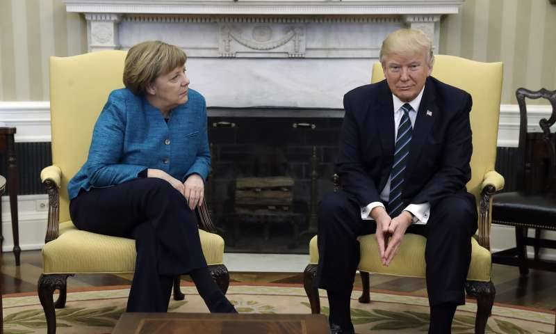Angela Merkel looks bemused by Donald Trump wiretapping joke