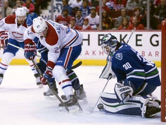 Canadiens edge Canucks in OT for 6th straight win