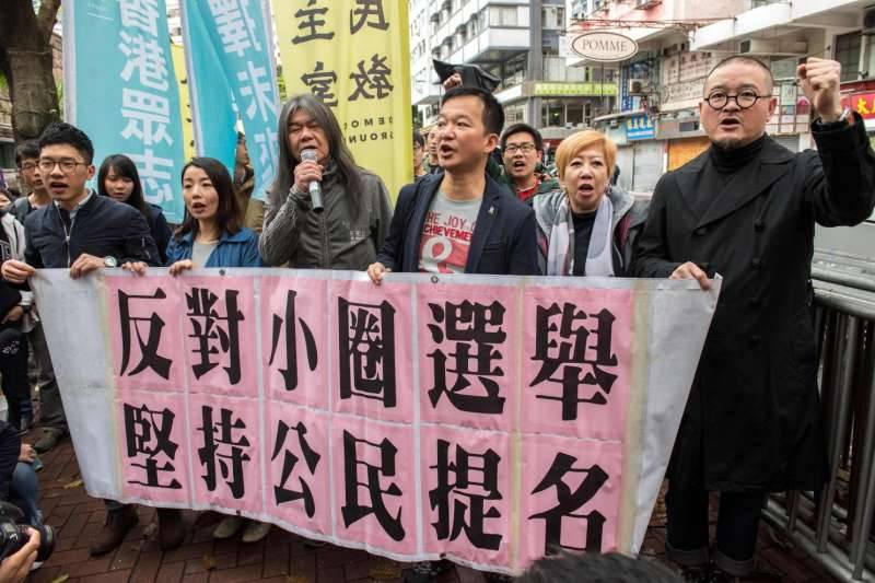 Day after new pro-Beijing chief chosen, Hong Kong police move to arrest activists