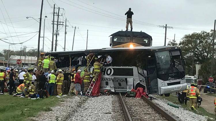 Train hits charter bus in Mississippi, killing four people