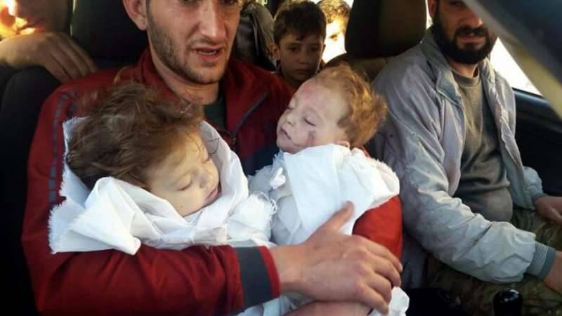 A father bids farewell to twin babies after Syria attack