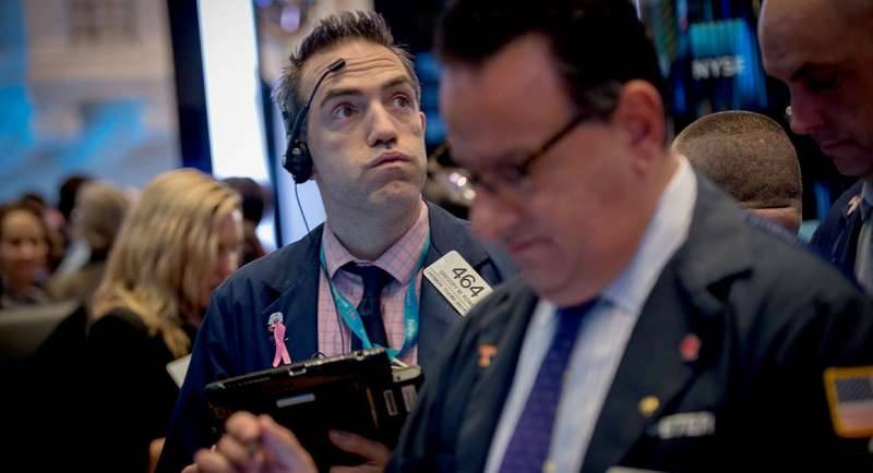 Investors rein in their Trump-fueled optimism