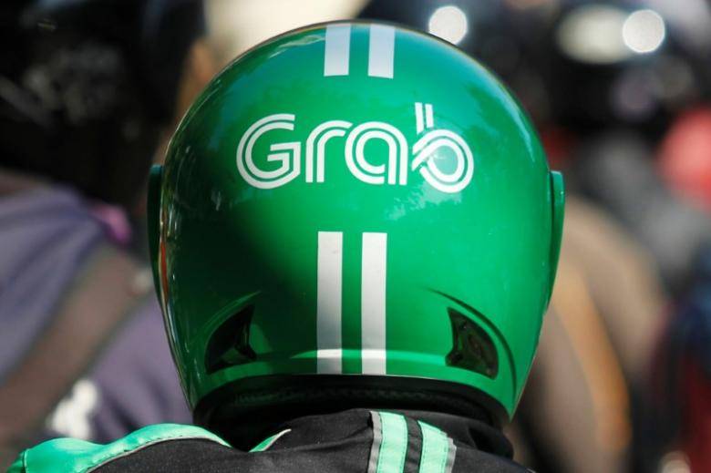 Ride-hailing firm Grab agrees to buy Indonesian payment startup Kudo