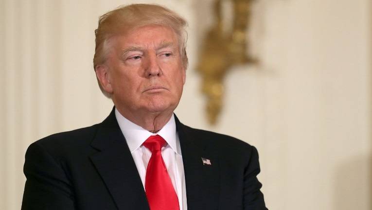 Besieged at home, Trump sets off for ‘do-or-die’ foreign trip