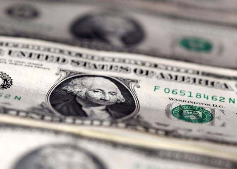 Dollar firm after bounce from lows, yuan slips on China downgrade