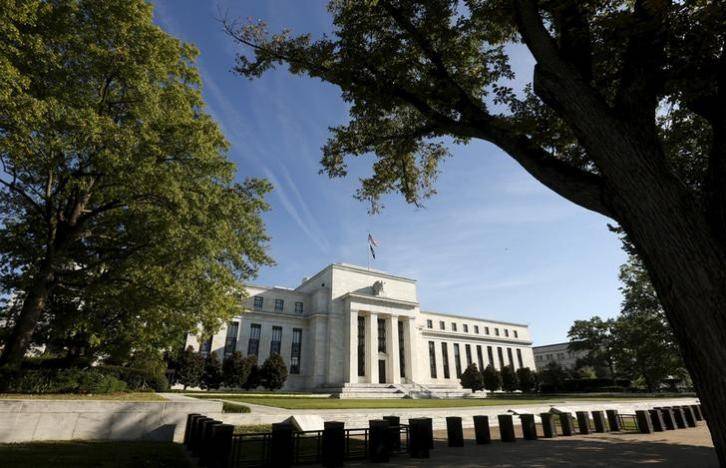 Fed holds interest rates steady, downplays economic weakness