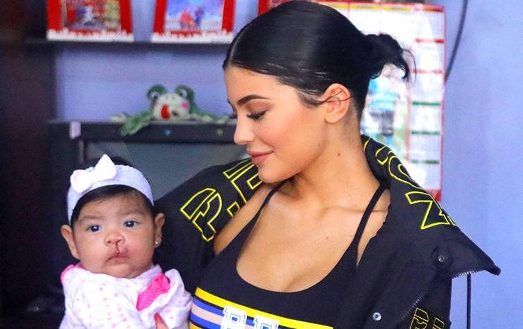 Kylie Jenner Cuddles Babies at Health Clinic During Philanthropic Trip to Peru