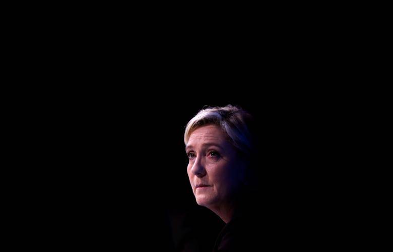 Le Pen as president would seek French electoral law change aide