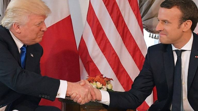 Macron explains his tense handshake with Trump