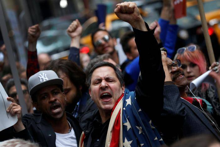 New York protesters greet Trump on first visit home