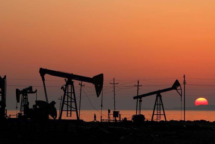 Oil eases, near weakest since late March on small U.S. stocks decline