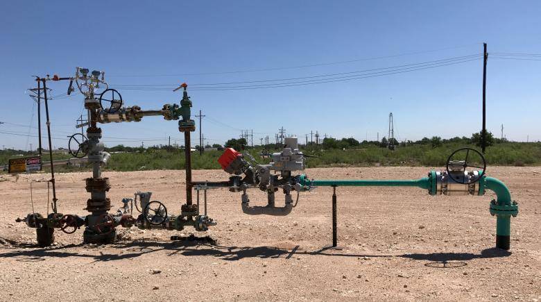 Big oil, small U.S. towns see new reward in old production technique