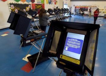 Hackers scour voting machines for election bugs
