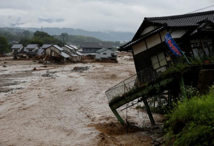 Japan rescuers dig through rubble as rain goes on, at least six dead