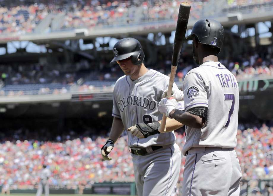 Lind, Goodwin homer in 5th, Nationals beat Rockies for split