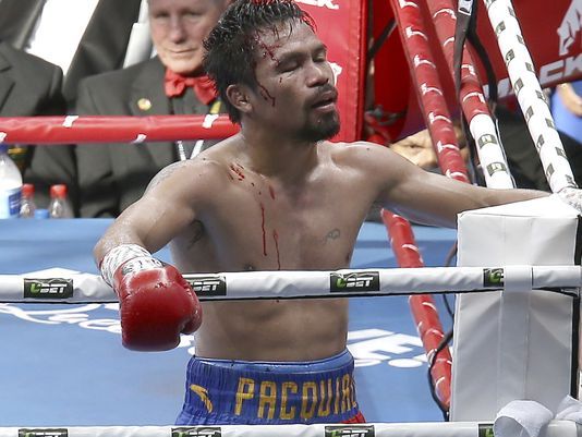 Pacquiao disagrees with re-score, says no plans to quit