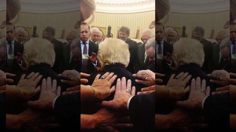 Trump seen bowing in prayer during Oval Office session