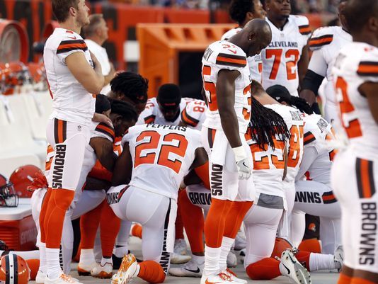 Browns players kneel in prayer during national anthem