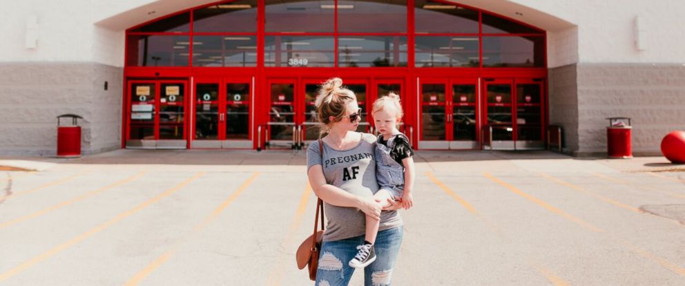 Expectant mom has fun maternity shoot at her favorite store