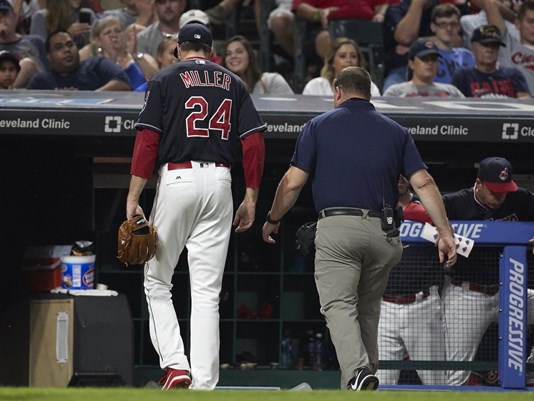 Indians’ Andrew Miller, Carlos Santana leave game with injuries