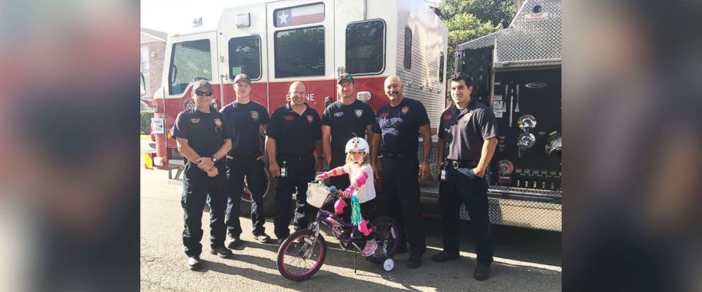 Little girl whose family couldn’t afford a bike gets surprise gift from paramedics