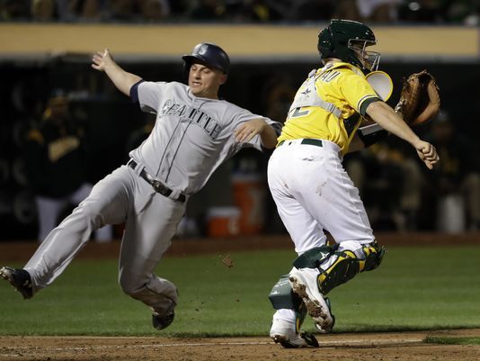 Martin powers Mariners past A’s 7-6 in 10