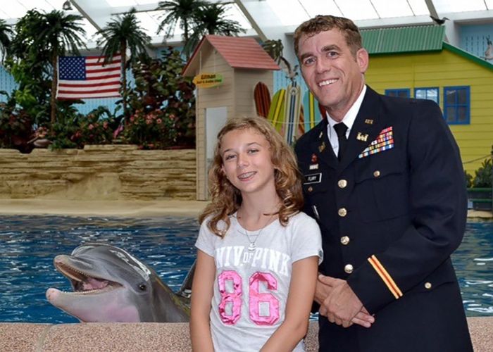 Girl, 12, surprised at dolphin show by military dad home from deployment