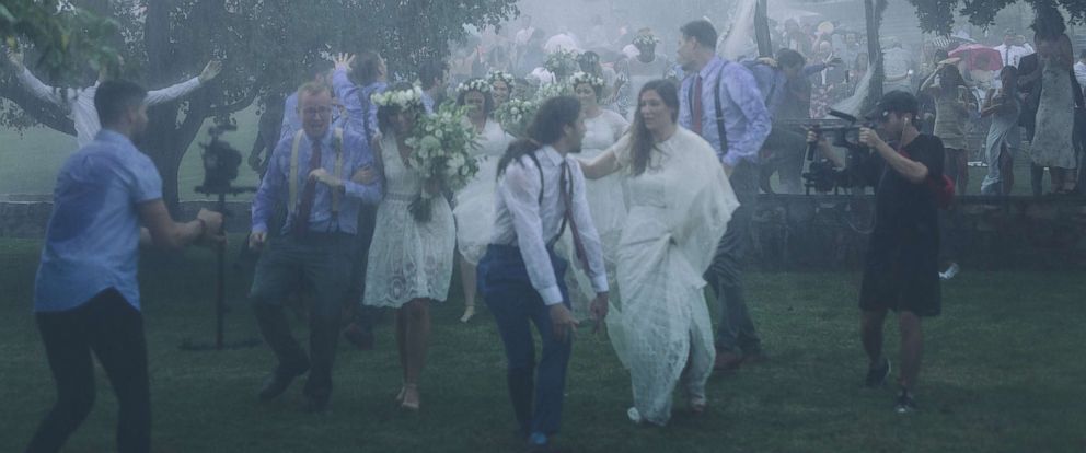 Bride and groom create epic music video in the pouring rain