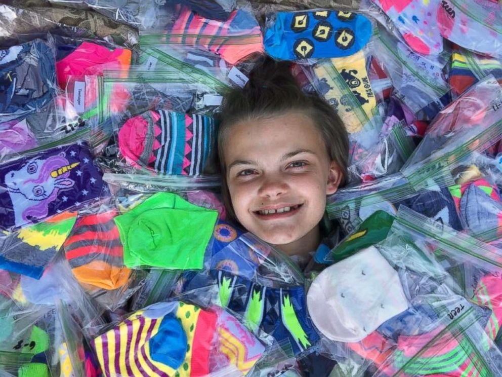 Girl collects more than 2,300 pairs of silly socks for fellow patients in hospital
