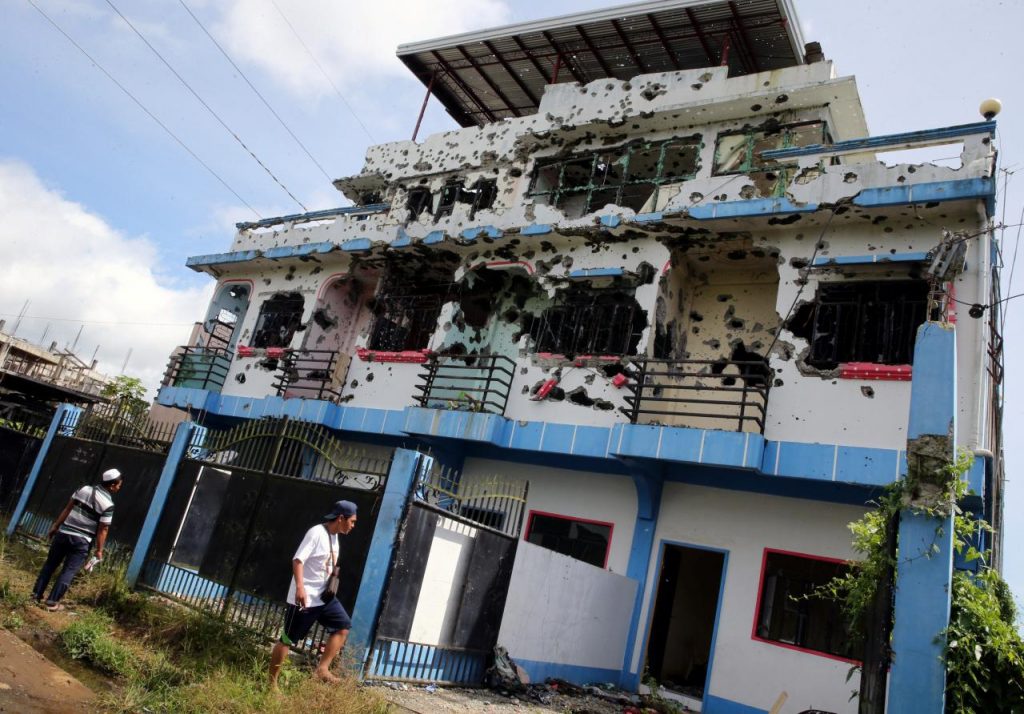 Koran, boots and scarves all that remain in Philippine rebel leader’s lair