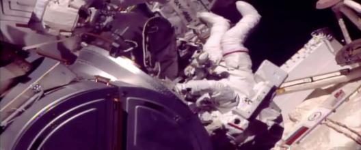 Spacewalking astronauts grease robot arm’s new hand
