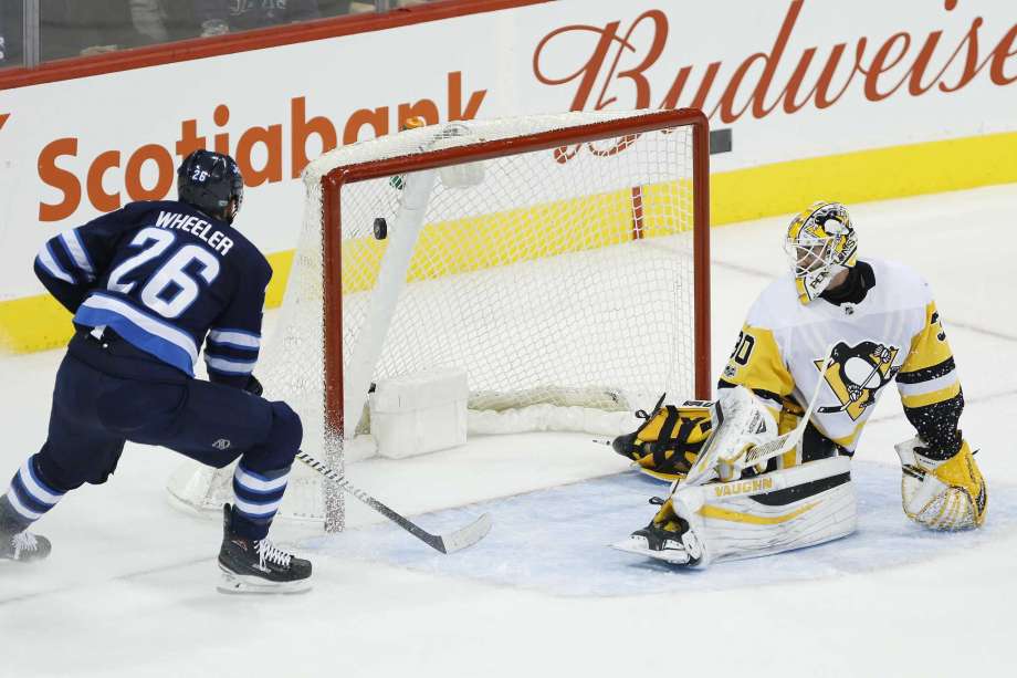 Wheeler scores 3 of Jets’ 5 goals in 1st to rout Pens 7-1