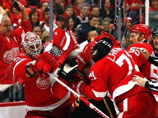 Red Wings, Flames brawl in Detroit’s blowout win