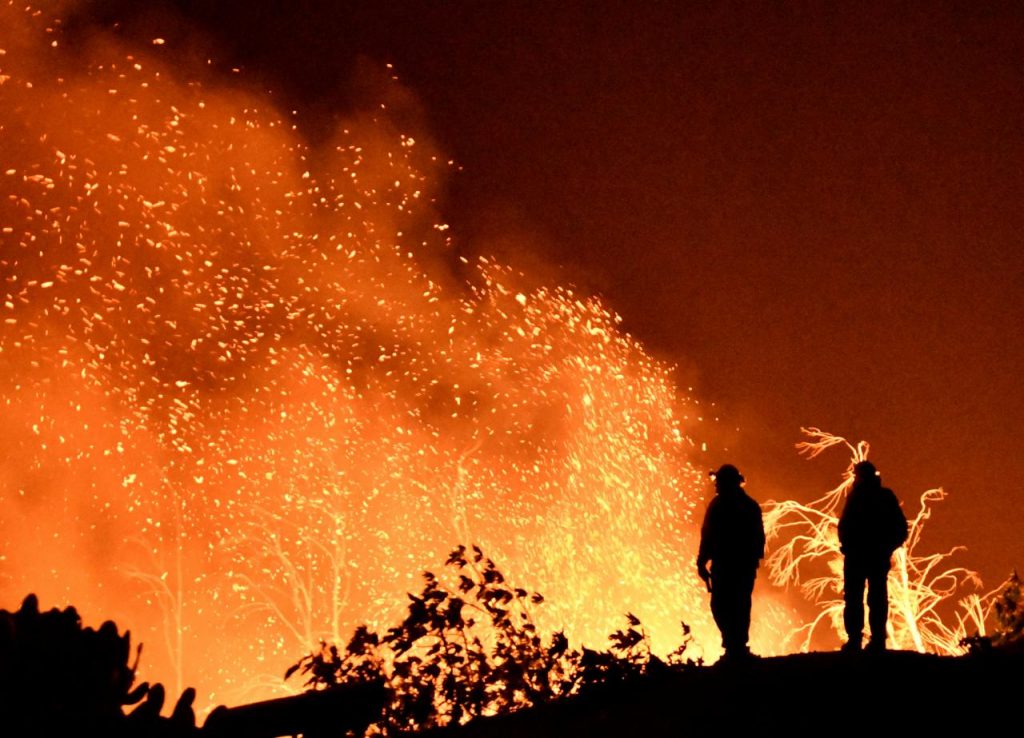 Break in winds helps California battle historic wildfire