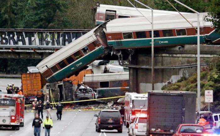 At least 3 killed after Amtrak train derails in Washington state, spilling rail cars onto busy highway
