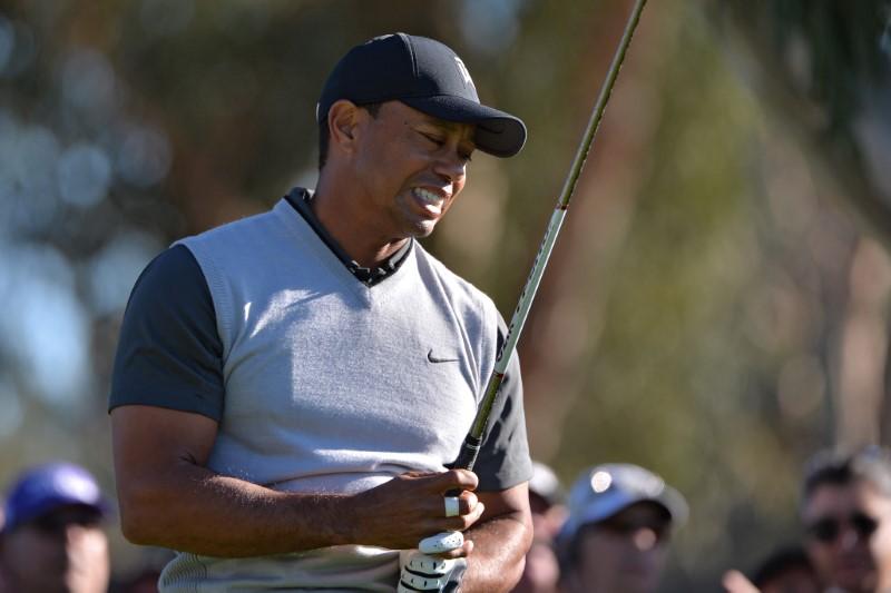 Golf: Inconsistent Woods six behind first-round leaders at Riviera