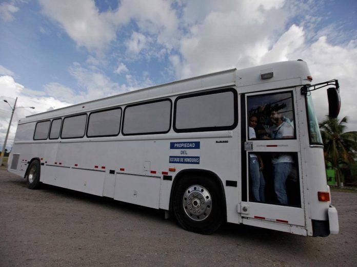 FILE PHOTO: Bus carrying deportees from the U.S. leaves the international airport in San Pedro Sula Trump administration moves to expel some 57000 Hondurans, Politics News, Latest Politics News, Politics News Usa, Politics Live News, Top Politics News, Politics Live News Online