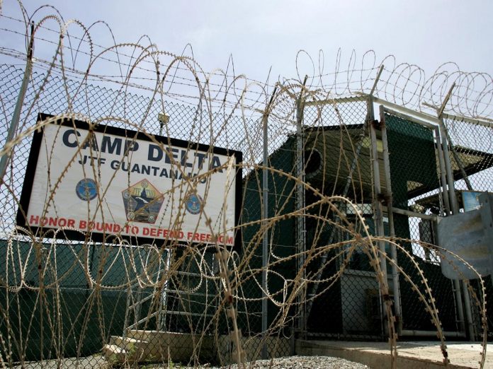 FILE PHOTO: The front gate of Camp Delta is shown at the Guantanamo Bay Naval Station in Guantanamo Bay U.S. transfers inmate from Guantanamo even as Trump hints at refilling it, Politics News, Latest Politics News, Politics News Usa, Politics Live News, Top Politics News, Politics Live News Online