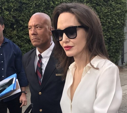 Comfortable customer! Angelina Jolie waves to a few fans as she tries to keep low-profile Comfortable customer! Angelina Jolie waves to a few fans as she tries to keep low-profile