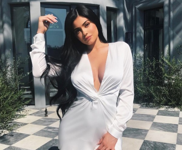 Kylie Jenner Hides Her Baby Bump Under Massively Large Men’s Shirt